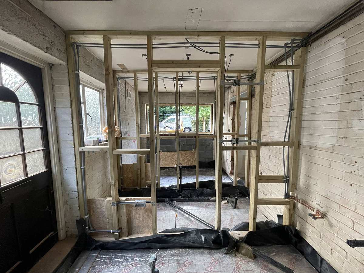 A garage in Hertfordshire stripped back and propped ready for conversion