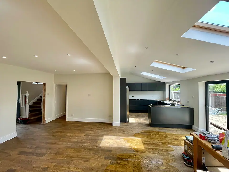 Open-plan extension with roof lights and a wood floor