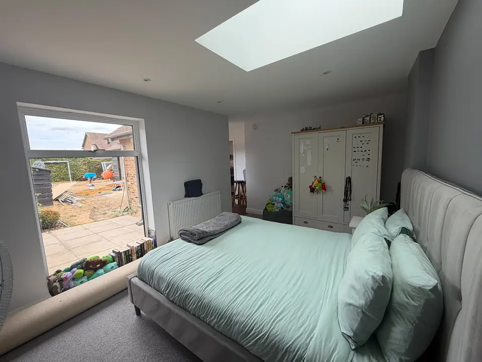 Garage converted to a bedroom with an en-suite in Watford by Dacorum Builders